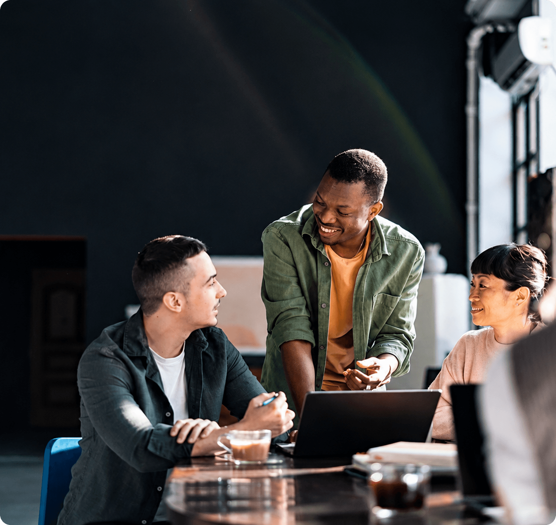Zentexx product team collaborating on laptop in modern studio office
