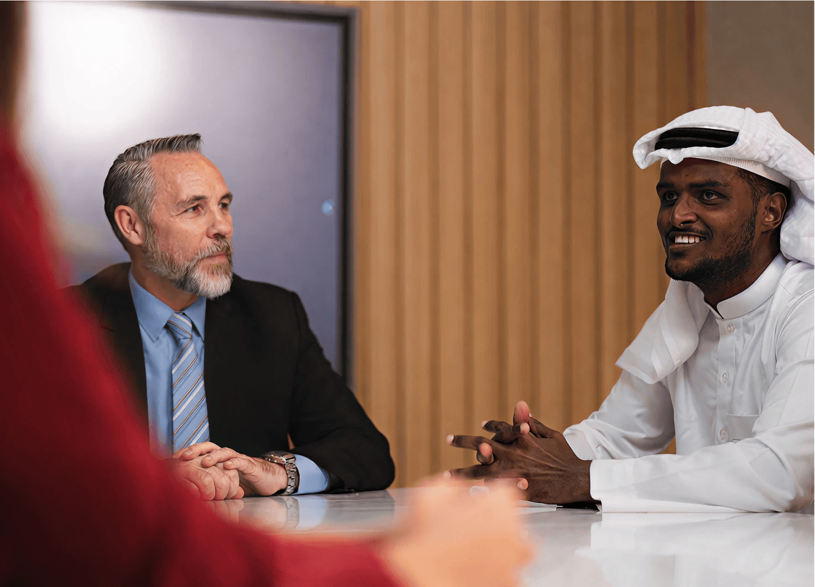 Two professionals in business discussion, dedicated team engagement model