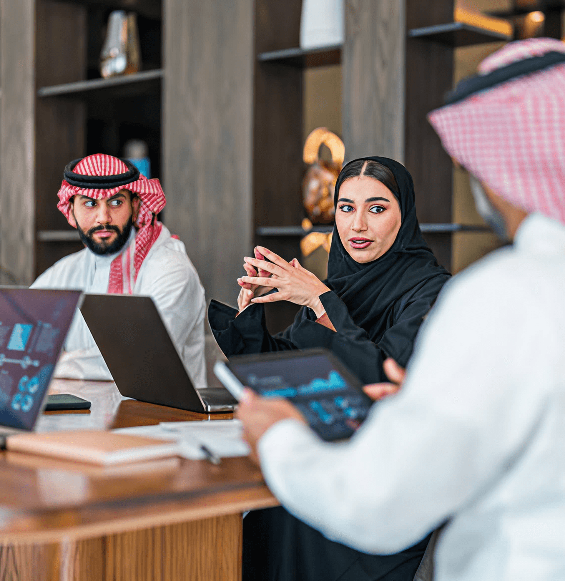 Zentex Doha engineering team discussing web product development on laptop