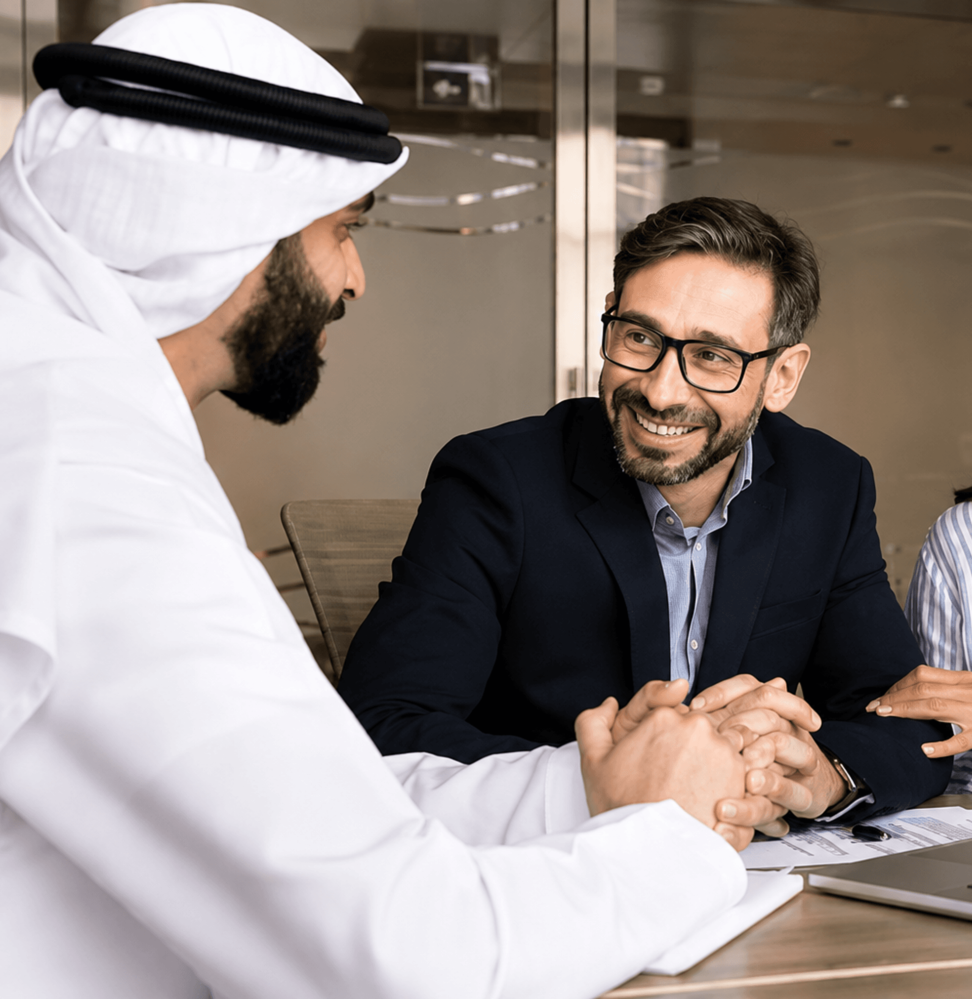 Zentexx Abu Dhabi product design team shaking hands in business meeting