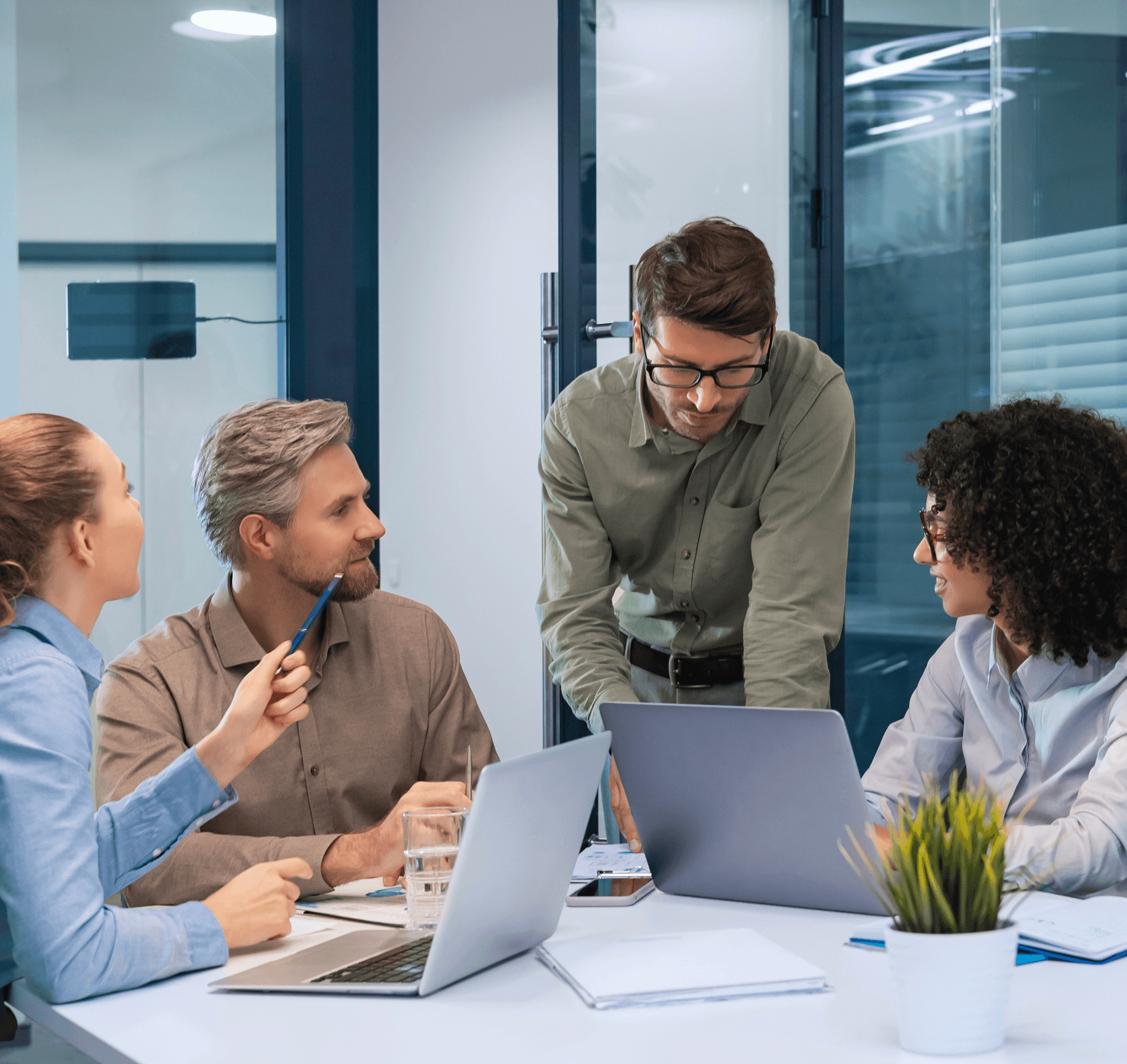 Zentexx Berlin product team collaborating in modern glass-walled meeting room