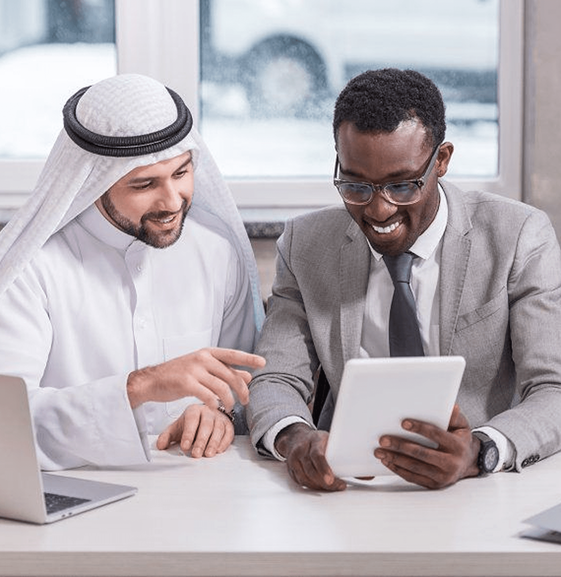 Zentex Dubai engineering team reviewing web product development project on tablet